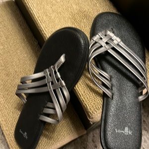 Gray strappy flip flops
